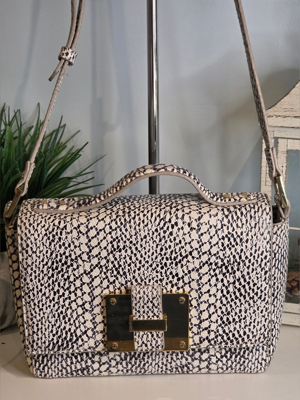 India Hicks "Lady P" handbag in snake-print leather.